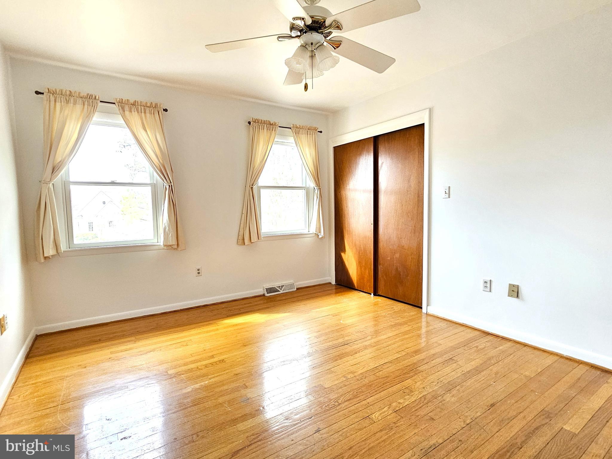 103 Shawnee Circle Cambridge, MD 21613 - Photo 31 of 49 a view of an empty room with wooden floor and a window