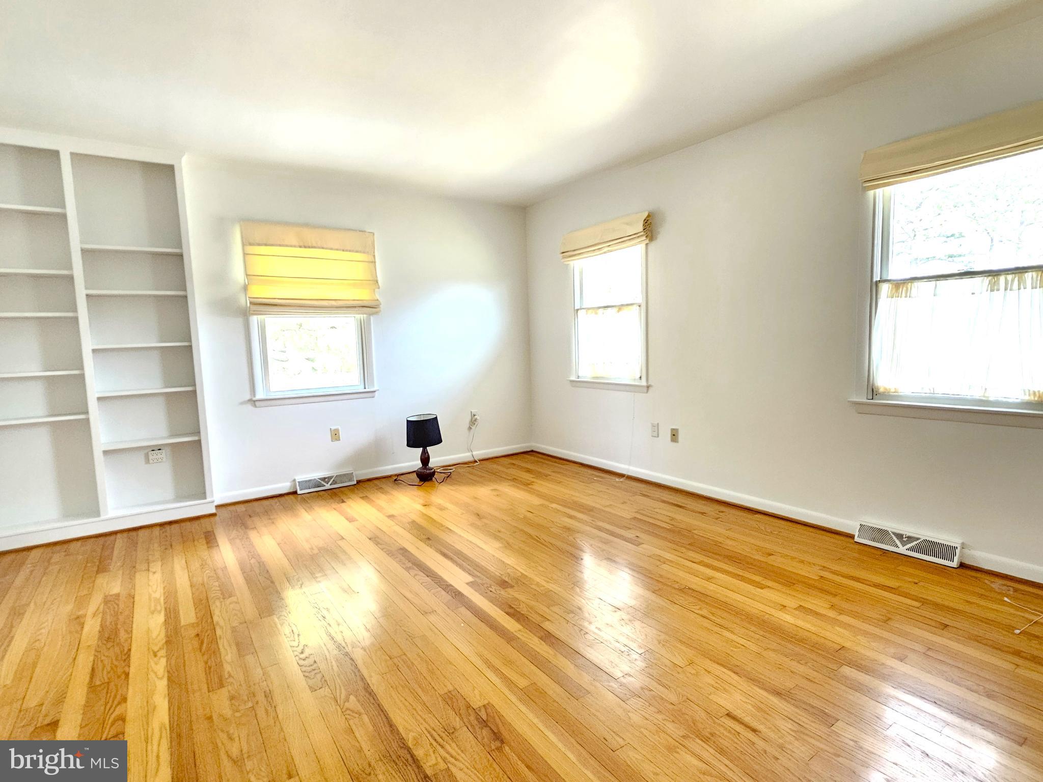 103 Shawnee Circle Cambridge, MD 21613 - Photo 37 of 49 a view of an empty room with a window and wooden floor
