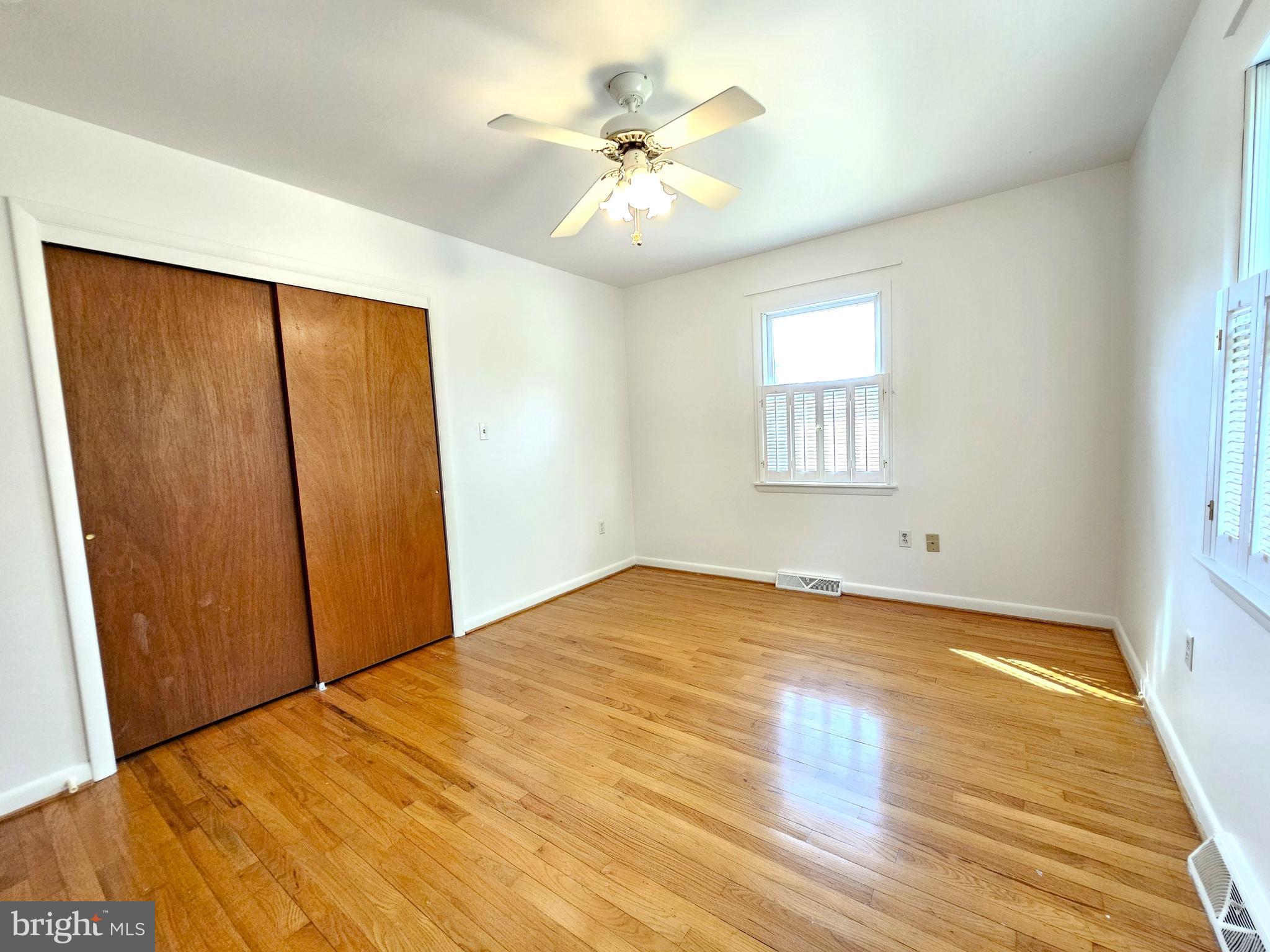 103 Shawnee Circle Cambridge, MD 21613 - Photo 44 of 49 a view of empty room with wooden floor and fan