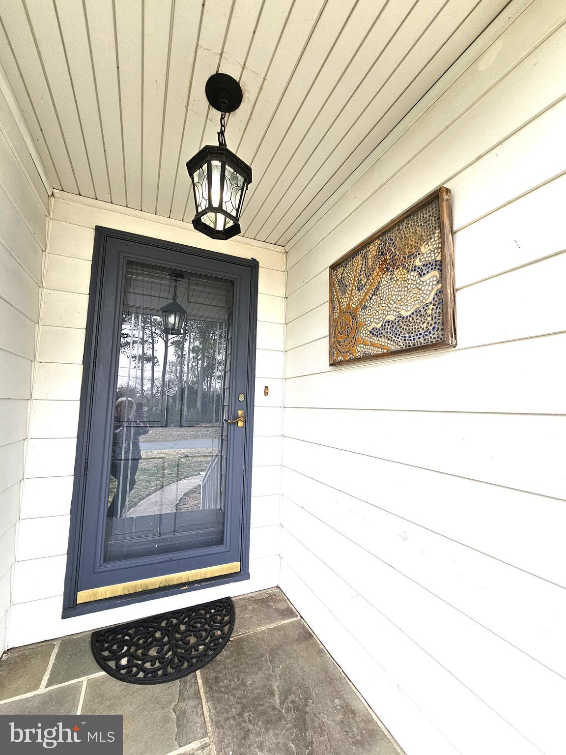 103 Shawnee Circle Cambridge, MD 21613 - Photo 7 of 49 a view of front door of house