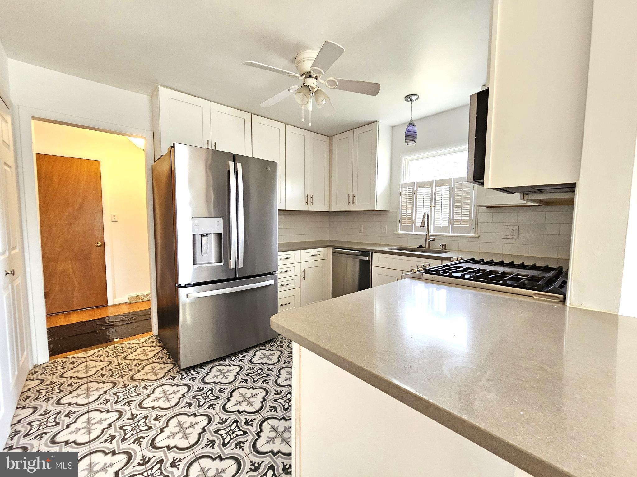 103 Shawnee Circle Cambridge, MD 21613 - Photo 8 of 49 a kitchen with stainless steel appliances granite countertop a refrigerator a stove a sink and a refrigerator