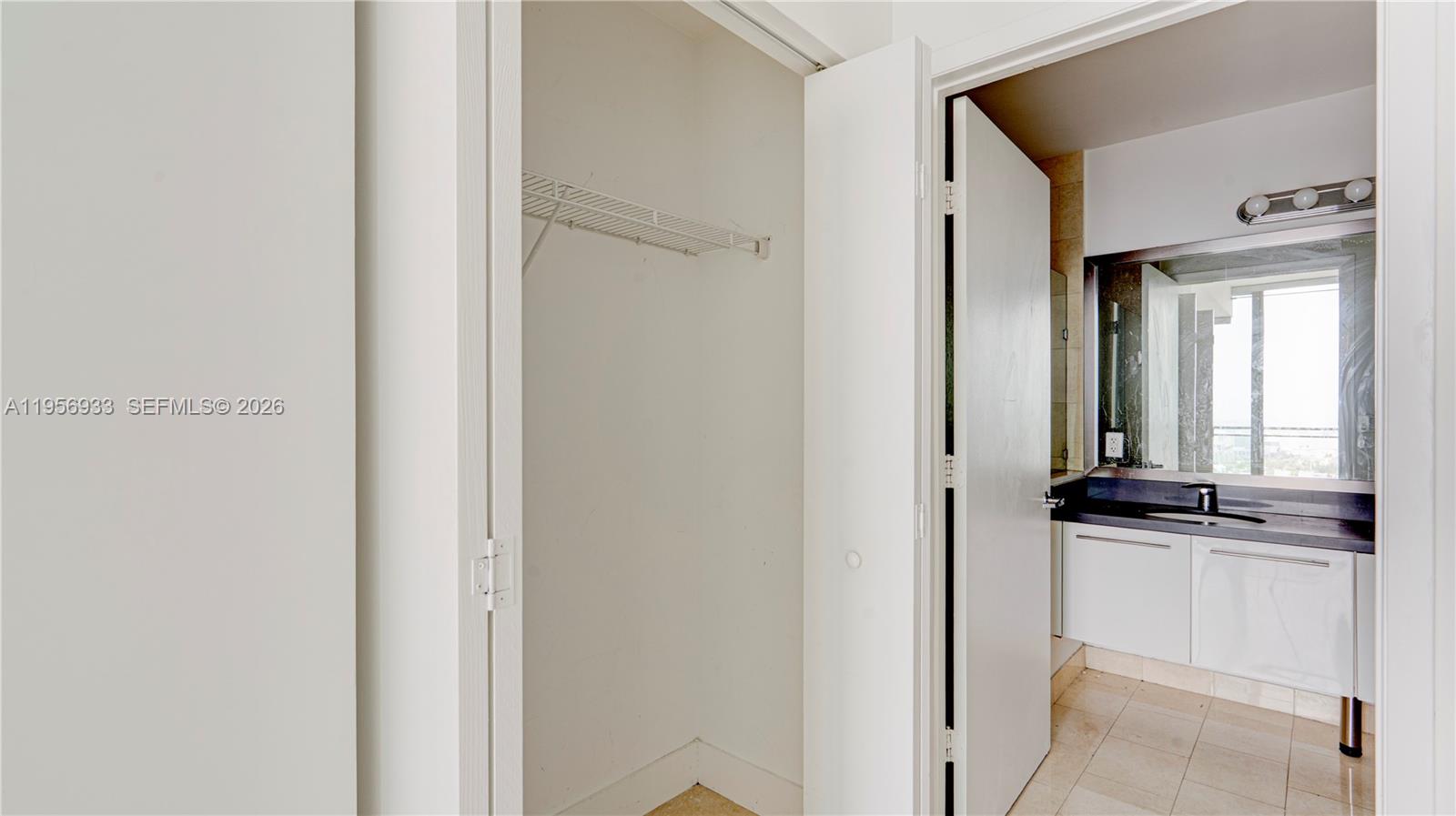 90 Southwest 3rd Street, Unit PH10 Miami, FL 33130 - Photo 13 of 31 a view of a kitchen from the hallway