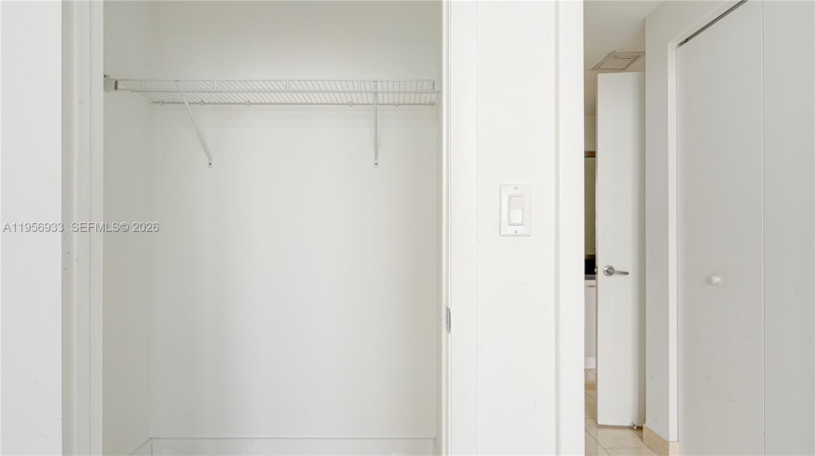 90 Southwest 3rd Street, Unit PH10 Miami, FL 33130 - Photo 30 of 31 a bathroom with a glass shower door