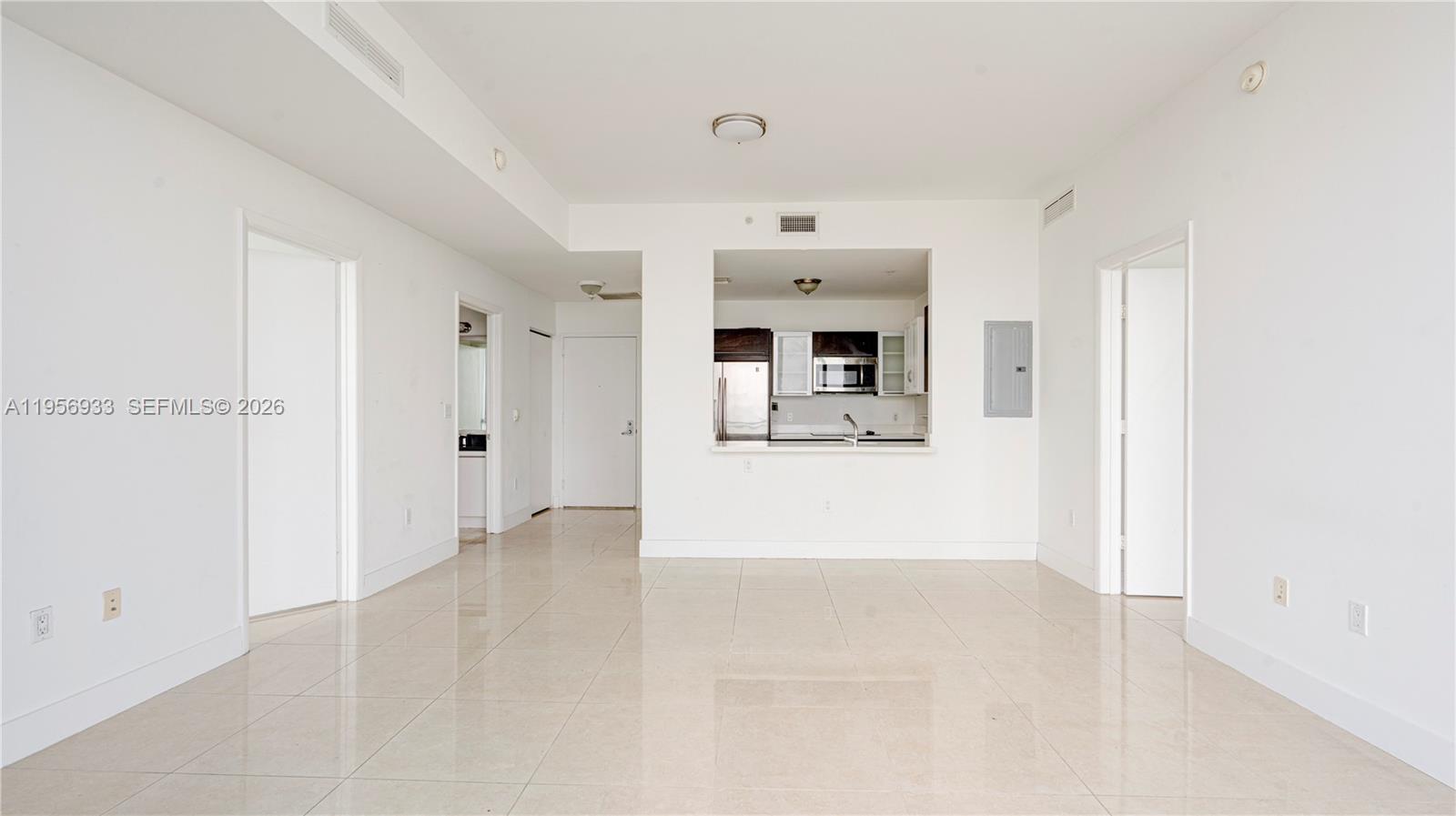 90 Southwest 3rd Street, Unit PH10 Miami, FL 33130 - Photo 5 of 31 a view of kitchen with refrigerator and window