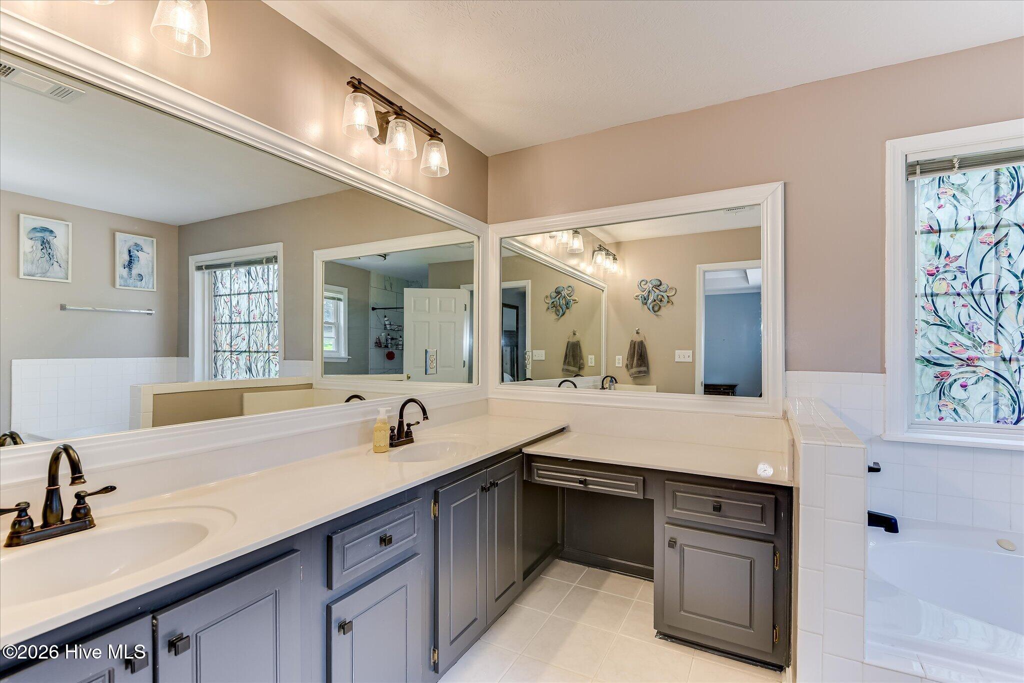 4480 Cape Cod Drive Evans, GA 30809 - Photo 17 of 55 Large En suite Bath with New Upgraded Shower and fixtures. Large Jetted tub, Make up counter and Double Sinks.
