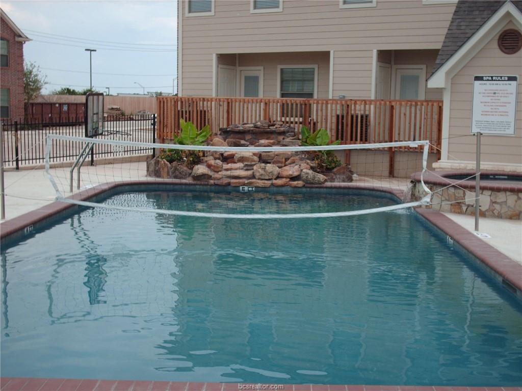1000 Spring Loop, Unit 1108 College Station, TX 77840 - Photo 2 of 3 a view of a house with a swimming pool