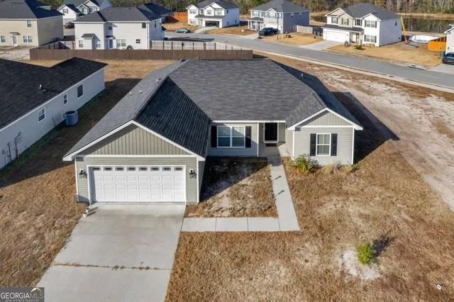 an aerial view of a house with swimming pool