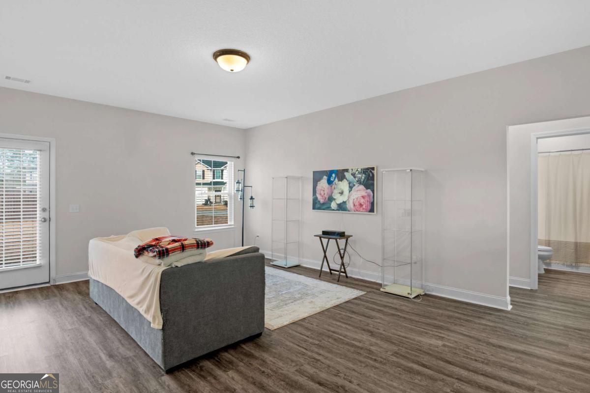 505 Rutledge Drive Hinesville, GA 31313 - Photo 13 of 24 a bedroom with furniture and a wooden floor