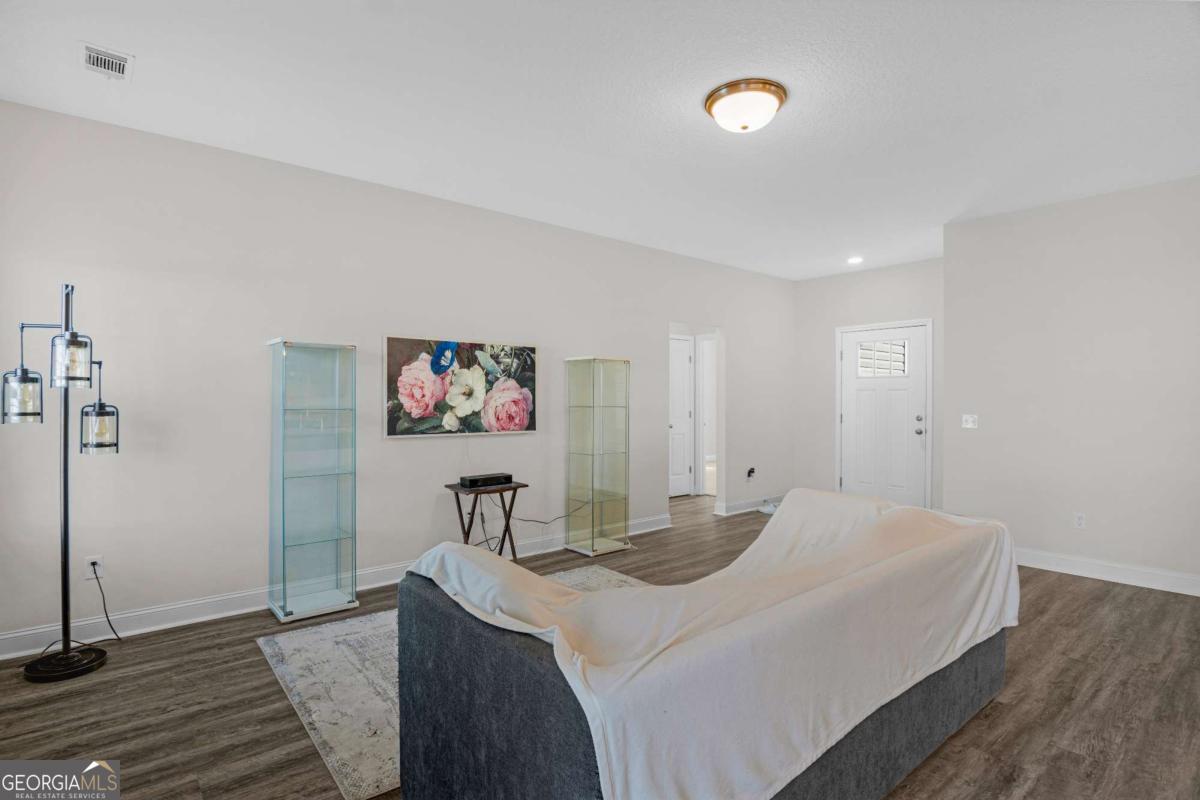 505 Rutledge Drive Hinesville, GA 31313 - Photo 14 of 24 a bedroom with a bed and a table