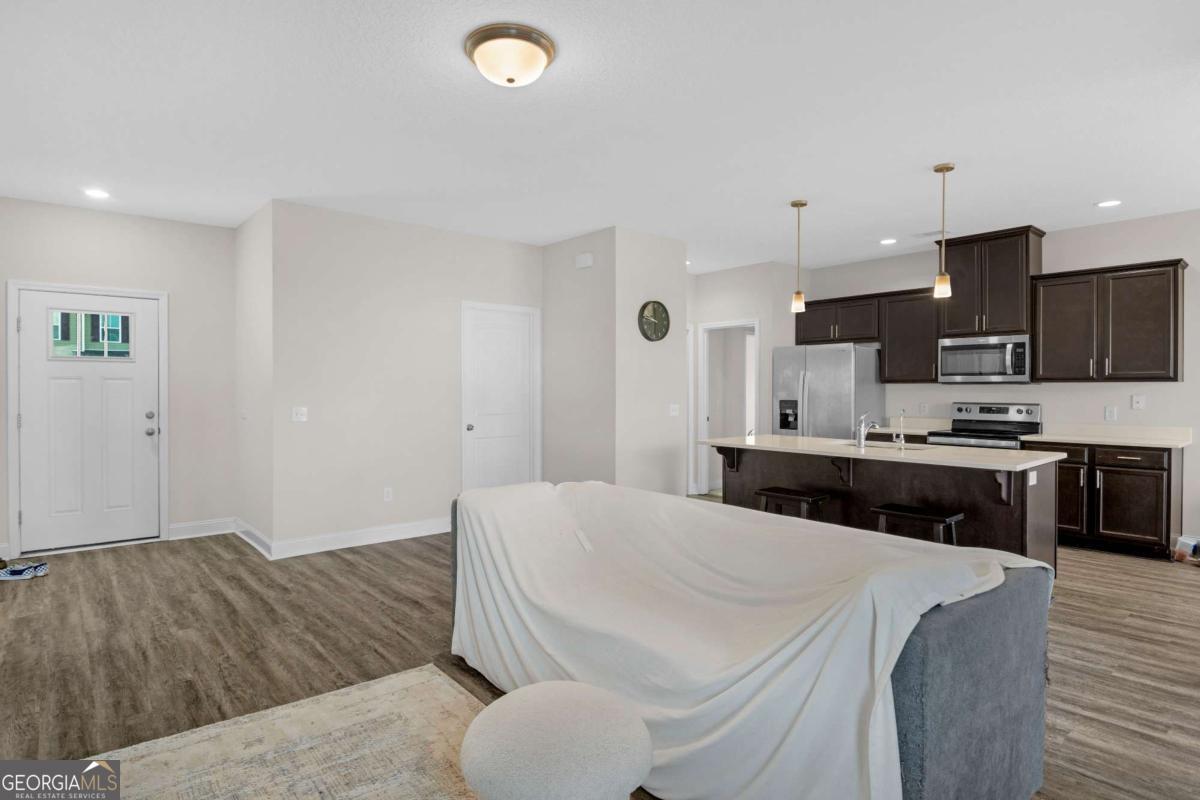 505 Rutledge Drive Hinesville, GA 31313 - Photo 15 of 24 a living room with furniture and kitchen