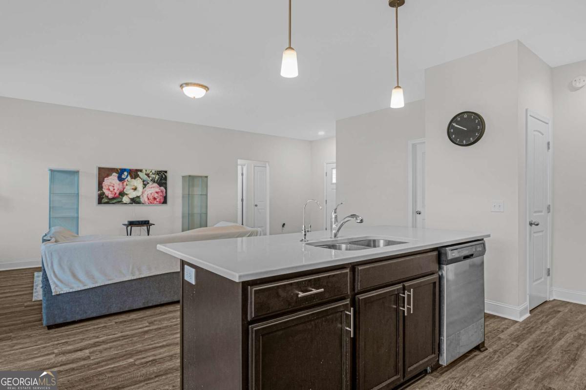 505 Rutledge Drive Hinesville, GA 31313 - Photo 20 of 24 a view of a kitchen with a sink and center island
