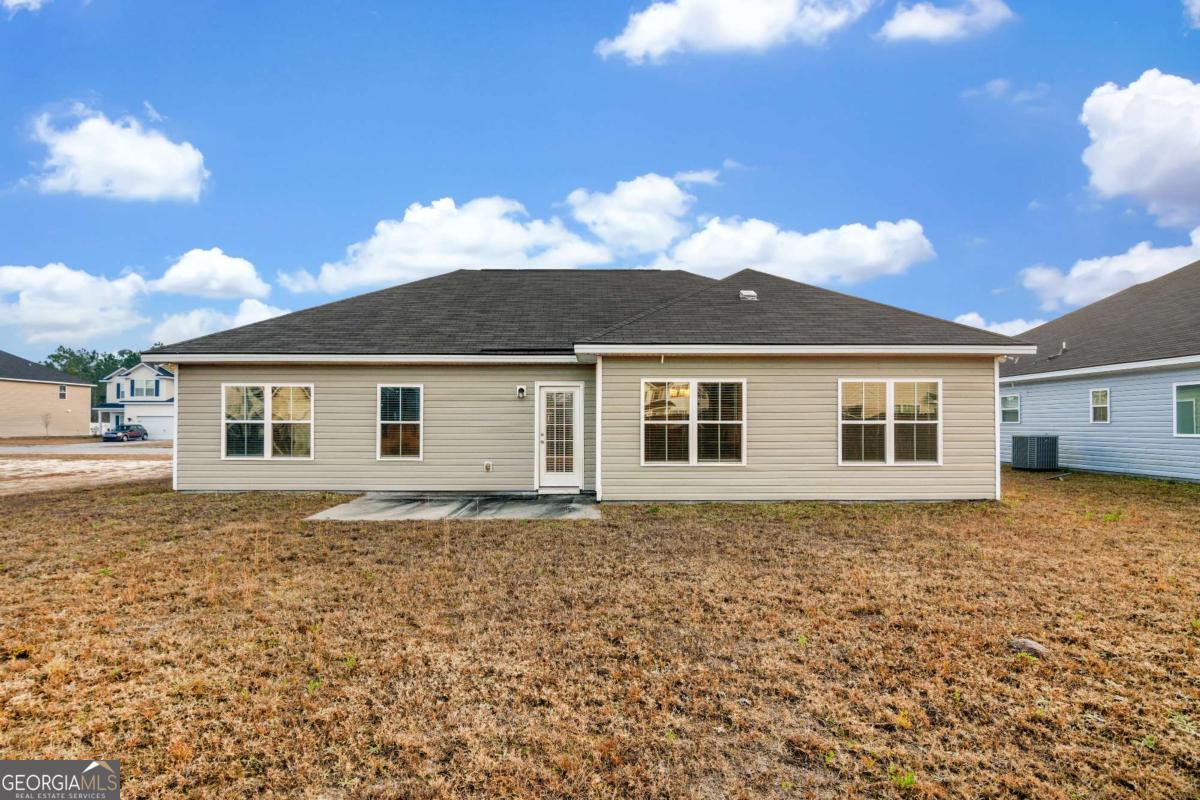 505 Rutledge Drive Hinesville, GA 31313 - Photo 23 of 24 a front view of a house with a yard
