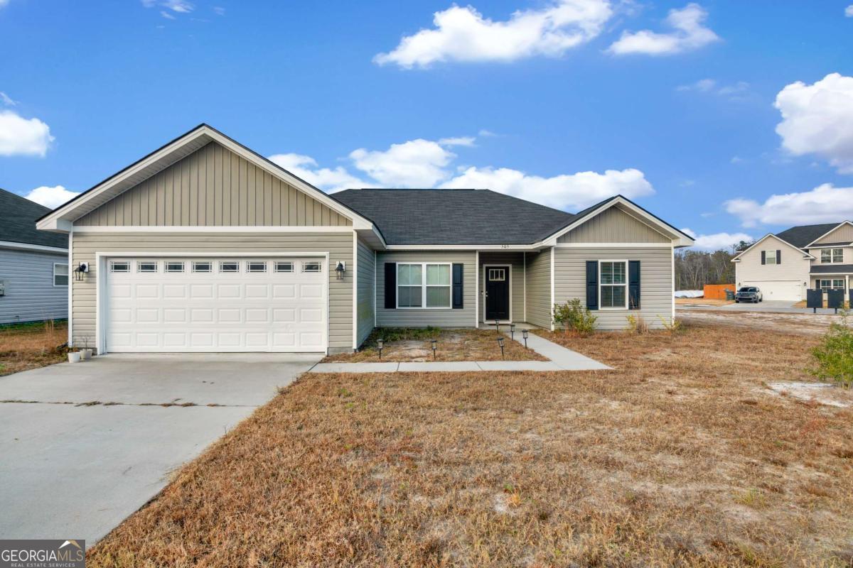 505 Rutledge Drive Hinesville, GA 31313 - Photo 24 of 24 a view of front of house with a yard