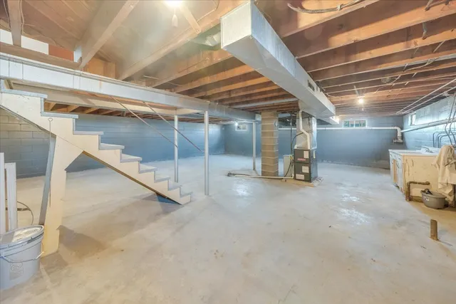 a view of a empty room with wooden floor