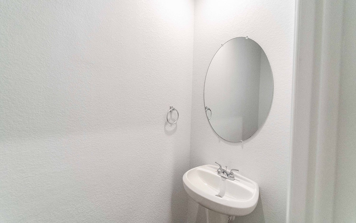 1718 Windrose Bend Angleton, TX 77515 - Photo 13 of 14 a bathroom with a sink and a mirror