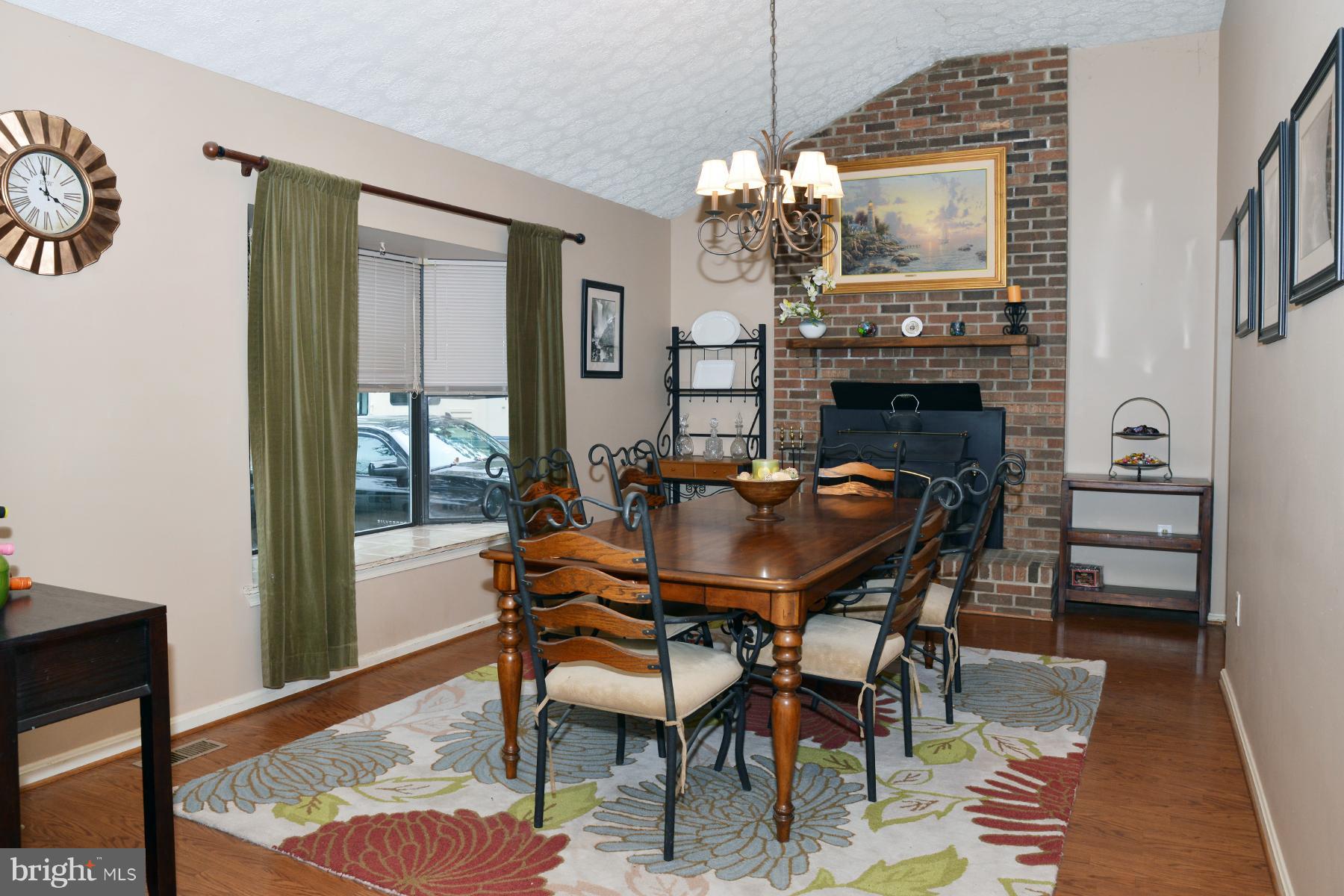 11427 Rawhide Road Lusby, MD 20657 - Photo 13 of 30 Dining Room w/Fireplace and Wood Stove Insert