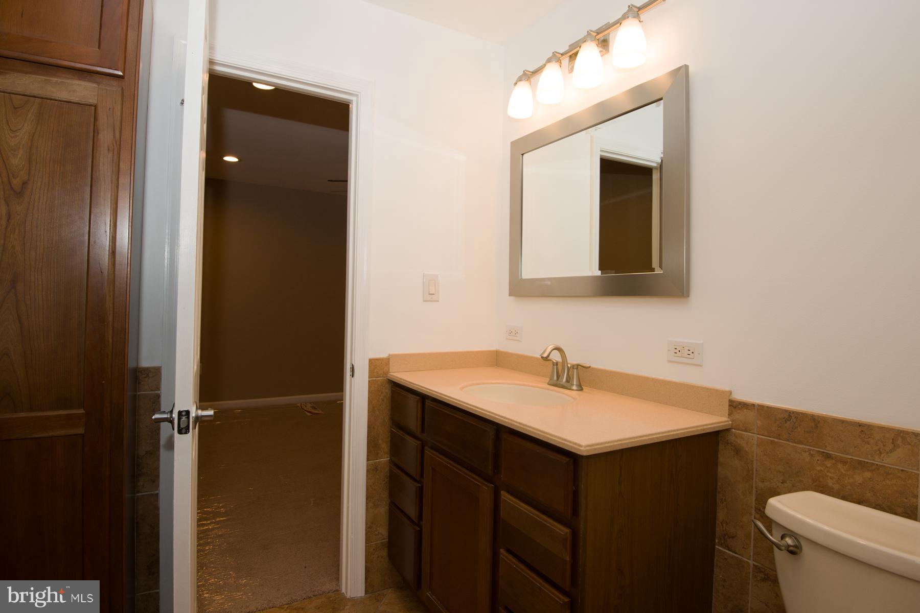 11427 Rawhide Road Lusby, MD 20657 - Photo 19 of 30 High Counter and Toilet