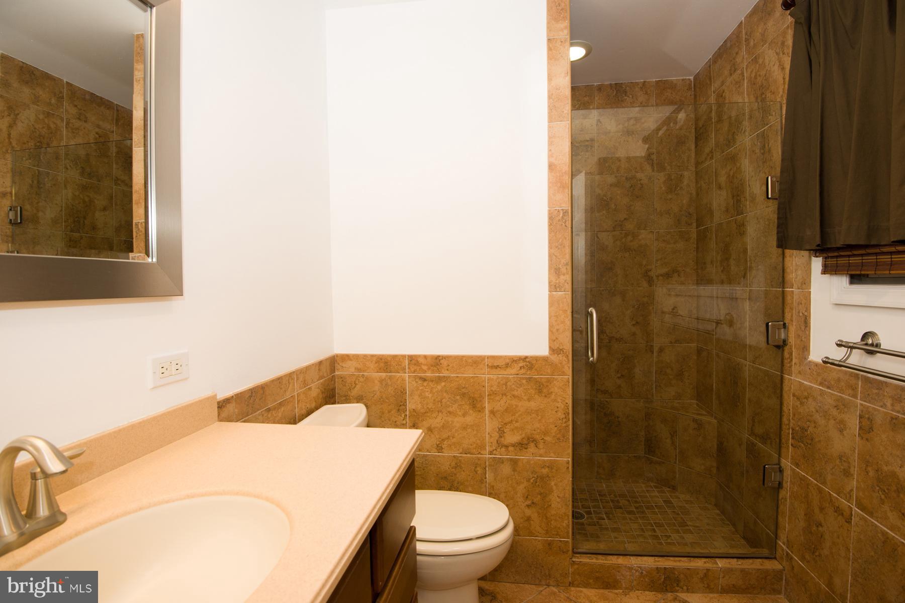 11427 Rawhide Road Lusby, MD 20657 - Photo 20 of 30 Tiled Walk In Shower with Glass Door