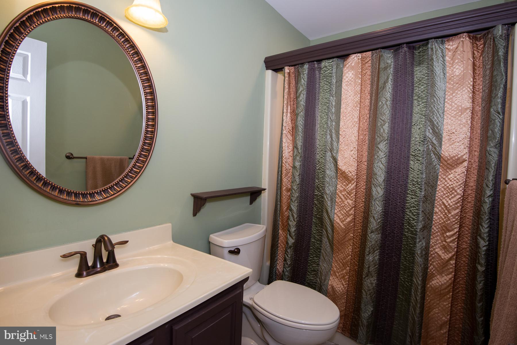 11427 Rawhide Road Lusby, MD 20657 - Photo 23 of 30 2nd Floor Bath with Tub Surround