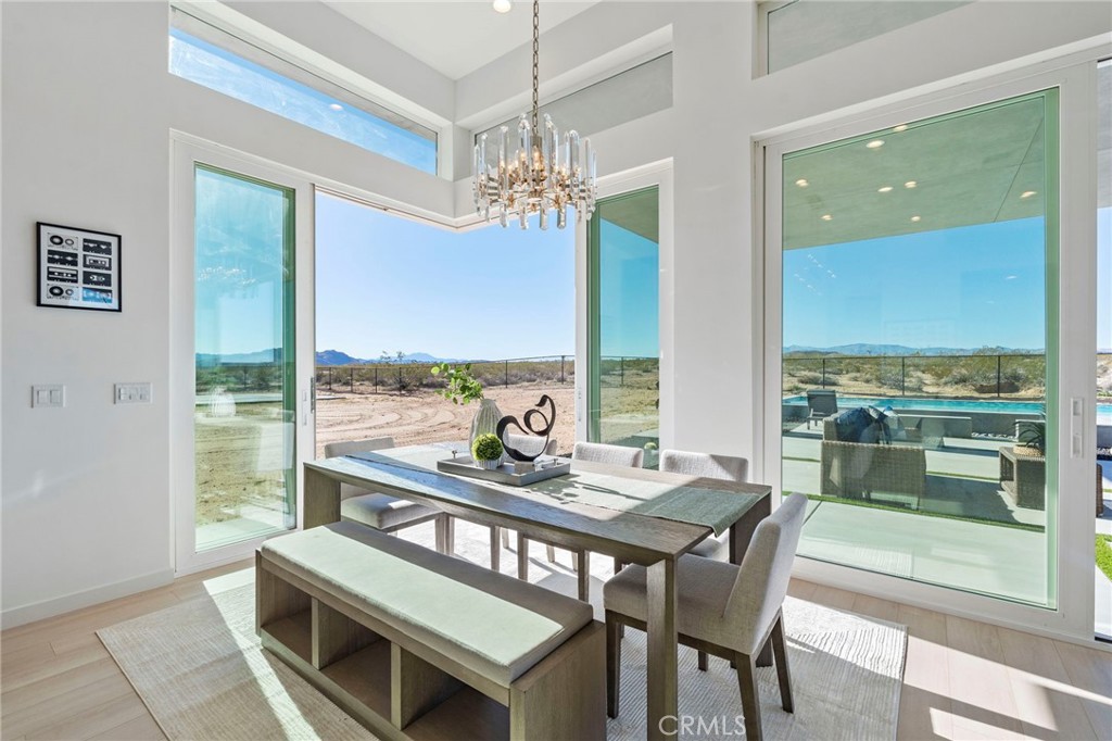 62050 Sonora Road Joshua Tree, CA 92252 - Photo 13 of 40 a view of a dining room with furniture window and outside view