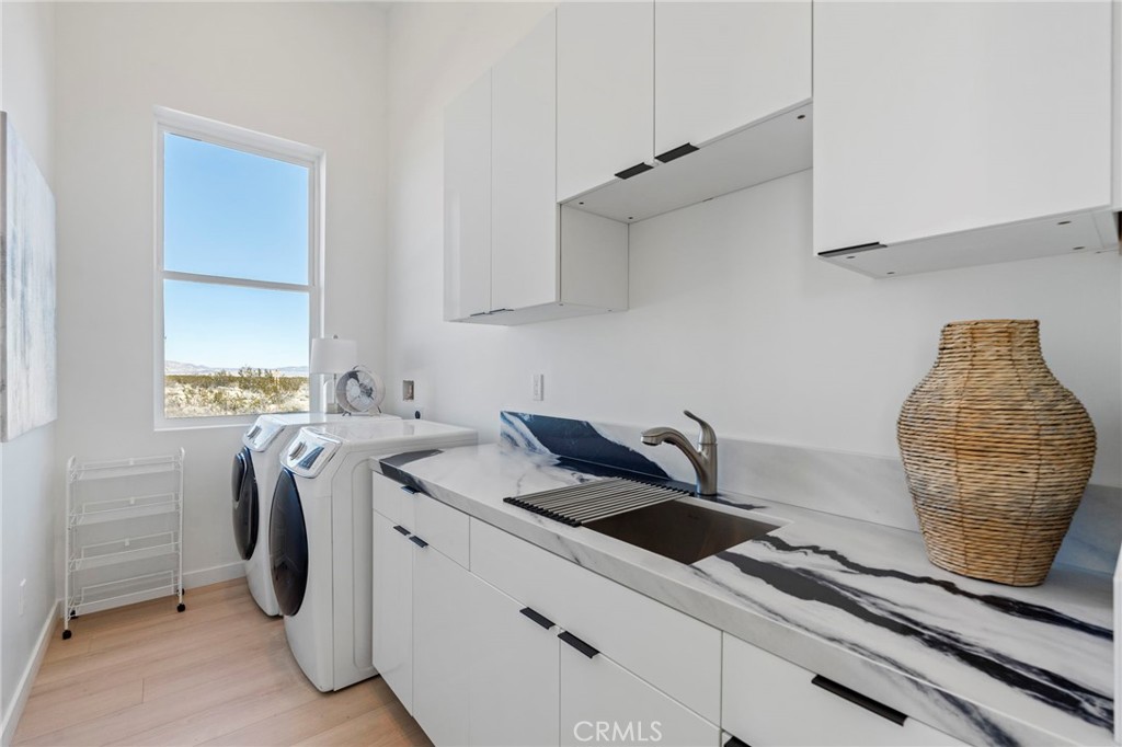62050 Sonora Road Joshua Tree, CA 92252 - Photo 23 of 40 a utility room with dryer and washer