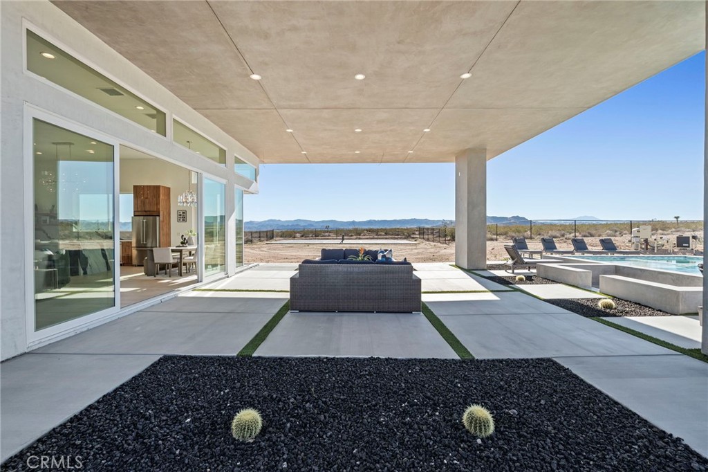 62050 Sonora Road Joshua Tree, CA 92252 - Photo 25 of 40 a view of a living room and floor to ceiling window or kitchen