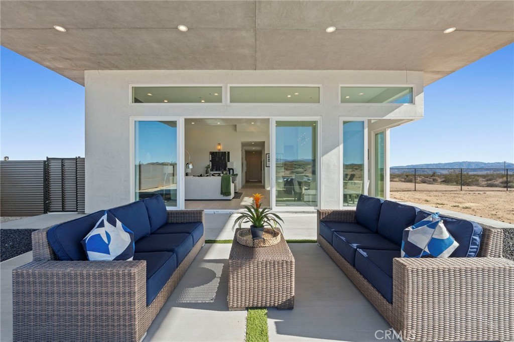 62050 Sonora Road Joshua Tree, CA 92252 - Photo 26 of 40 a living room with furniture and a large window