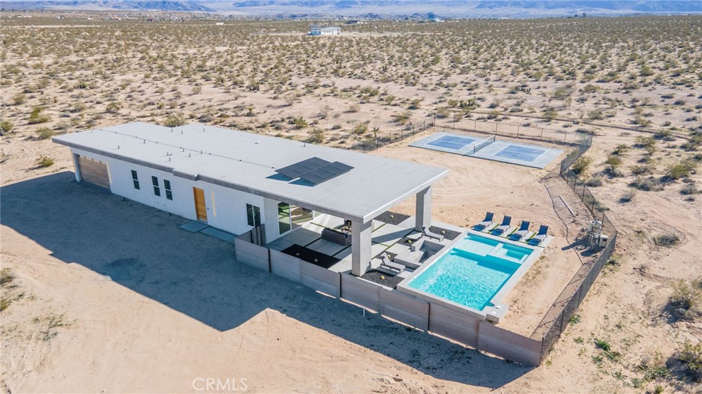 62050 Sonora Road Joshua Tree, CA 92252 - Photo 28 of 40 a view of a houses with sky view