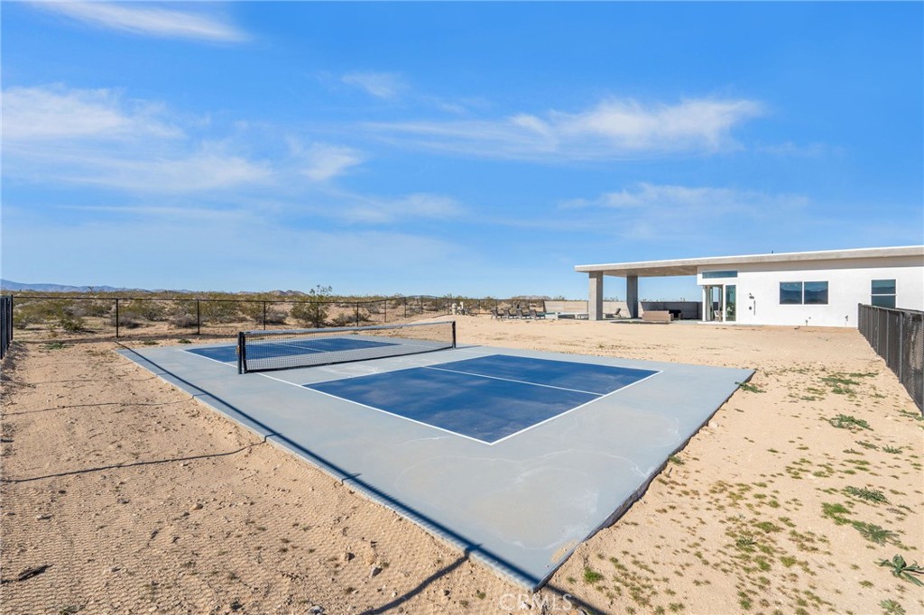 62050 Sonora Road Joshua Tree, CA 92252 - Photo 32 of 40 a view of swimming pool with an outdoor seating