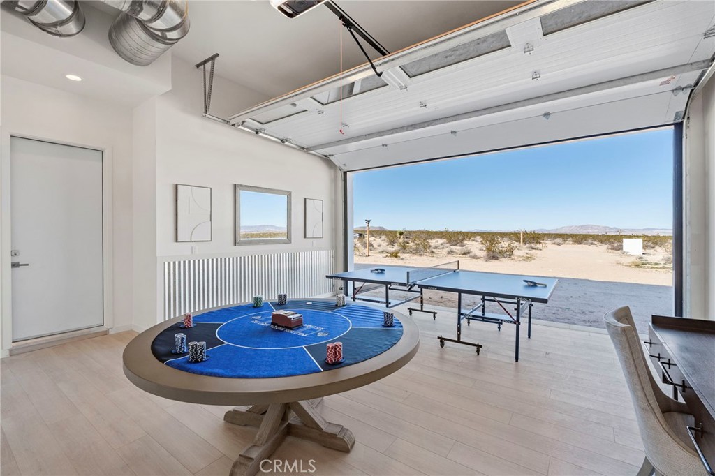 62050 Sonora Road Joshua Tree, CA 92252 - Photo 35 of 40 a view of a dining room with furniture window and wooden floor