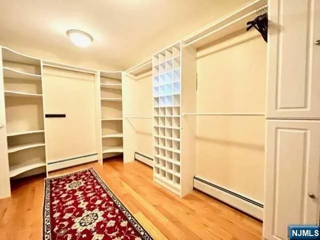 a bathroom with a glass shower door and a bathtub