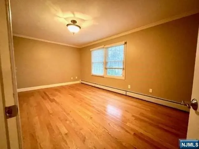 an empty room with a empty space and a window