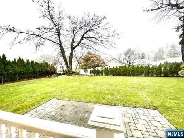 a view of a yard with an trees