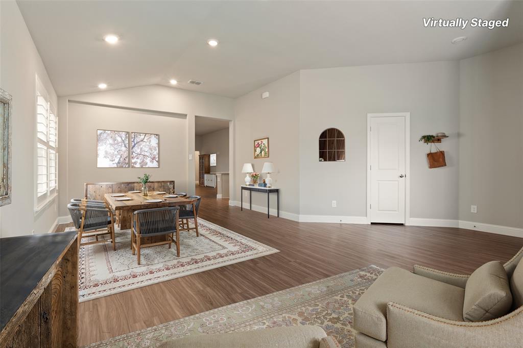 6909 Danridge Road Rowlett, TX 75089 - Photo 3 of 29 a living room with furniture and a wooden floor