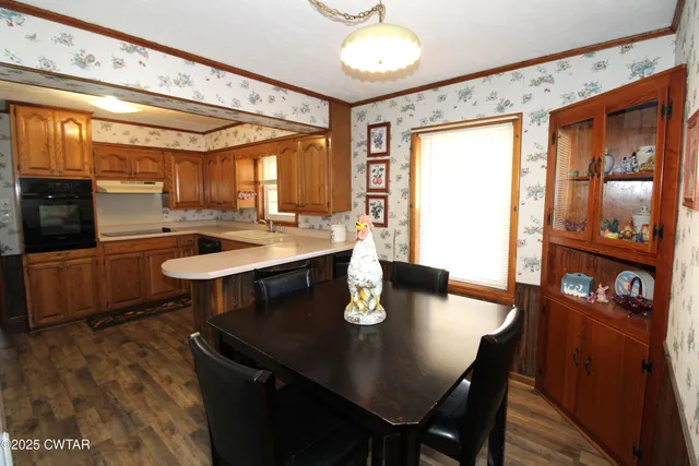 a view of a dining room with furniture and window