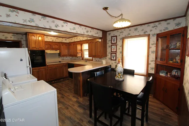 a dining room with furniture and window
