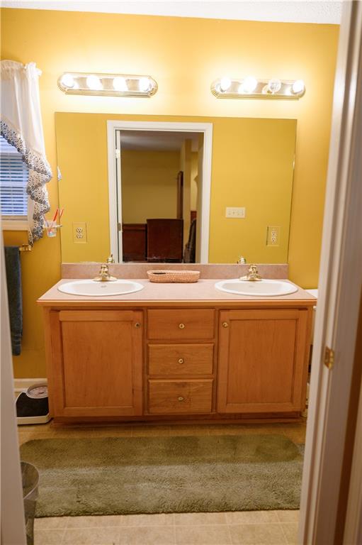 1581 Highway 77 Union Point, GA 30669 - Photo 12 of 17 a bathroom with a sink and a mirror