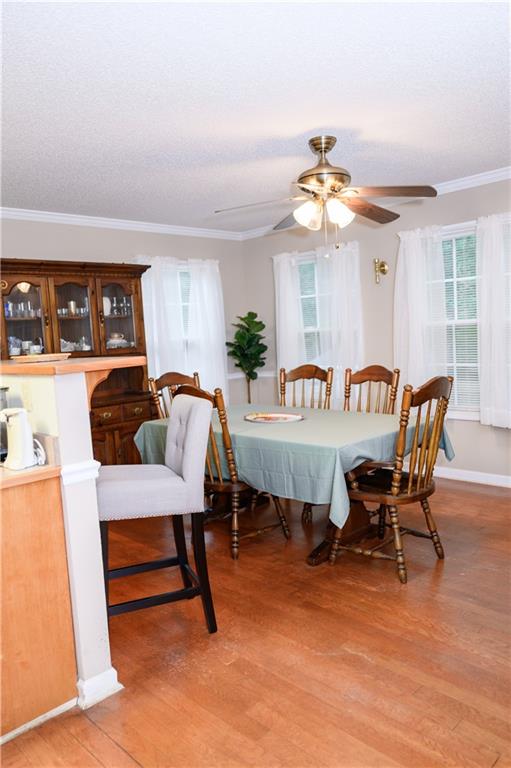 1581 Highway 77 Union Point, GA 30669 - Photo 6 of 17 a view of a dining room with furniture window and wooden floor