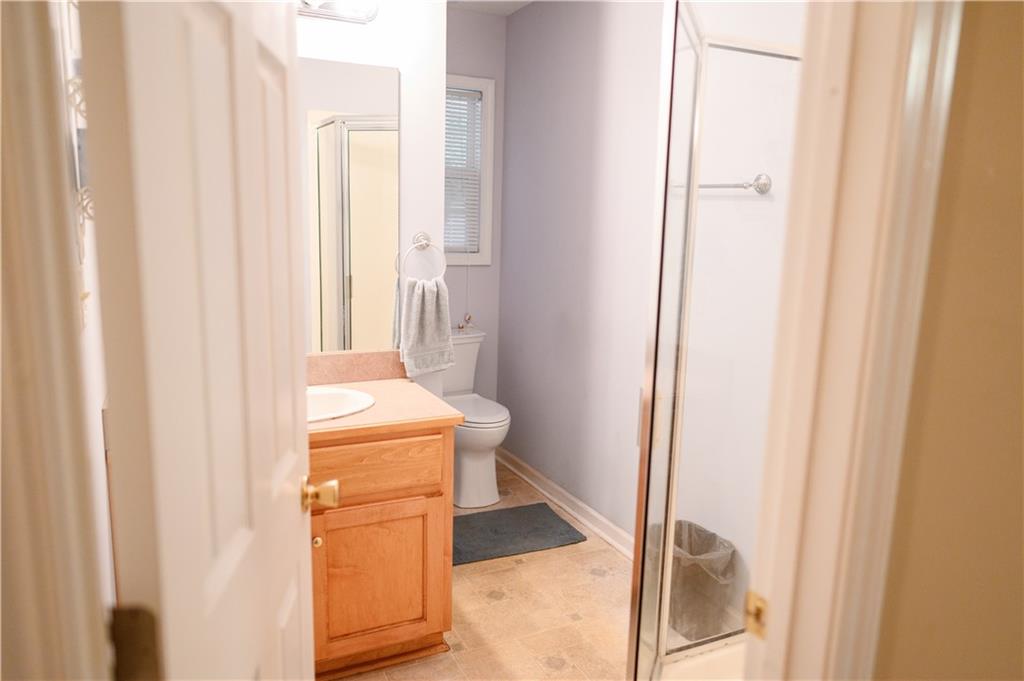 1581 Highway 77 Union Point, GA 30669 - Photo 8 of 17 a bathroom with a sink and toilet