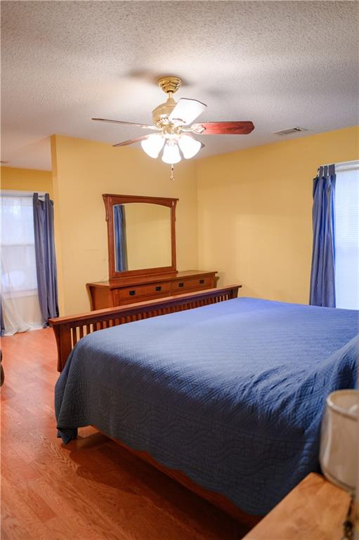 1581 Highway 77 Union Point, GA 30669 - Photo 10 of 17 a bedroom with a bed and a mirror