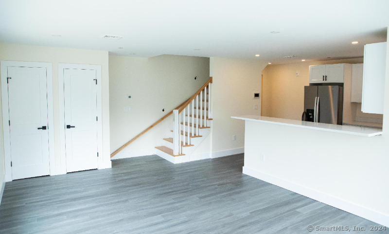 887 Federal Road, Unit 5 Brookfield, CT 06804 - Photo 5 of 15 a view of an entryway with wooden floor