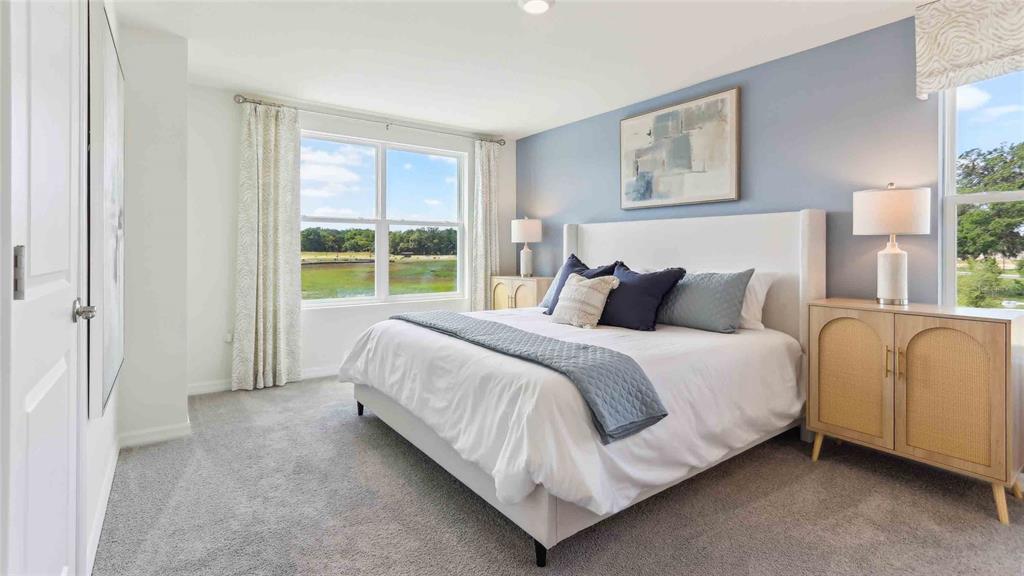 8196 Southwest 67th Avenue Ocala, FL 34476 - Photo 11 of 20 a bedroom with a bed and a large window