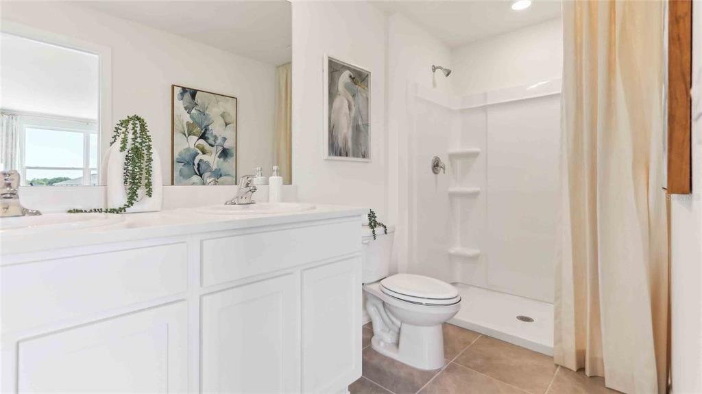 8196 Southwest 67th Avenue Ocala, FL 34476 - Photo 14 of 20 a bathroom with a sink toilet and shower