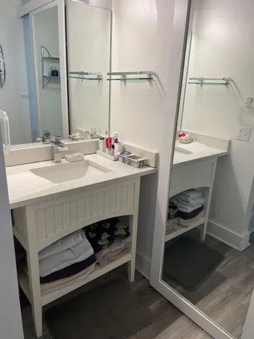 a bathroom with a sink and a mirror