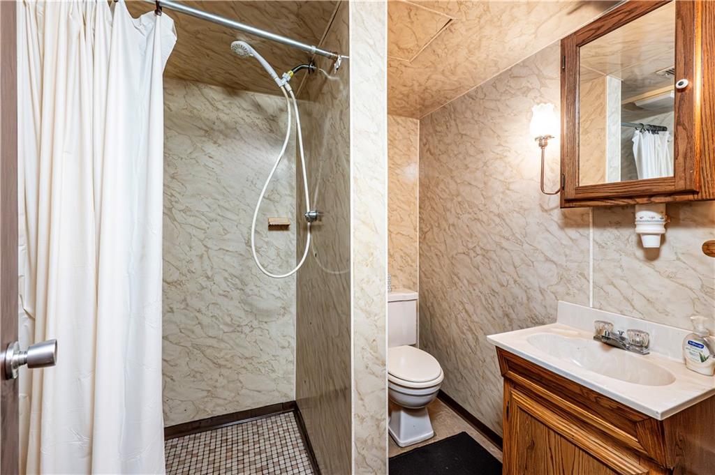 13740 Ridge Road Irwin, PA 15642 - Photo 27 of 43 a bathroom with a sink toilet and shower