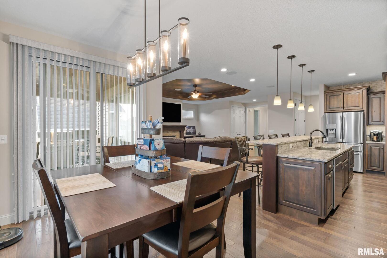 1422 Racine Court Davenport, IA 52804 - Photo 17 of 53 a large kitchen with a table and chairs