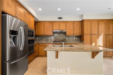 18 Coriander Irvine, CA 92603 - Photo 2 of 29 a kitchen with stainless steel appliances granite countertop a refrigerator a sink a stove with cabinets