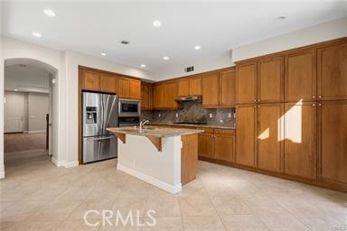 18 Coriander Irvine, CA 92603 - Photo 6 of 29 a kitchen with a refrigerator and a sink