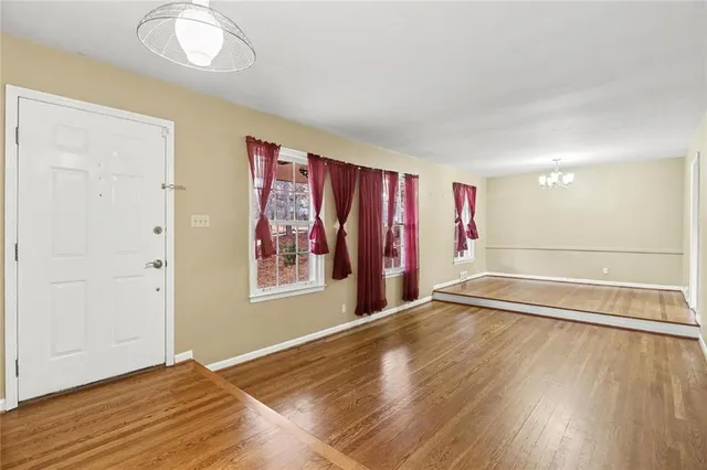 a view of a backyard with table and chairs and potted plants