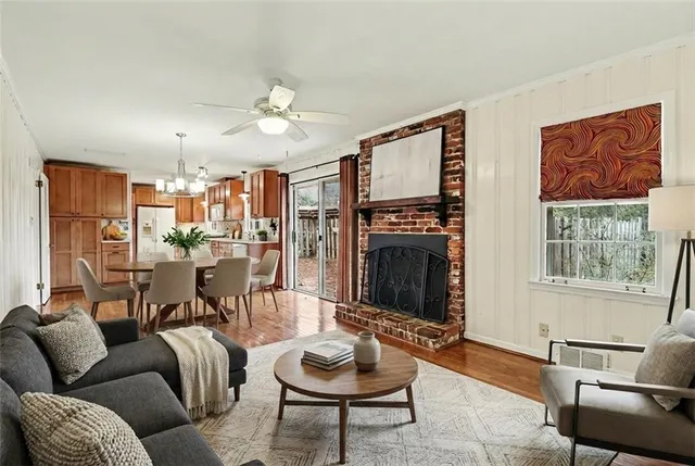 a living room with furniture and a fireplace